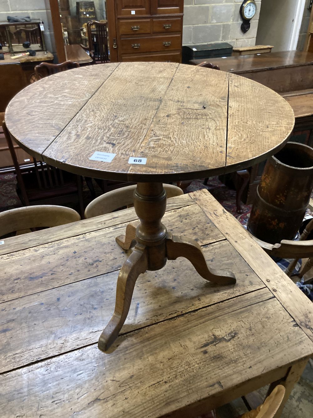 A George III oak tripod table, diameter 70cm height 67cm